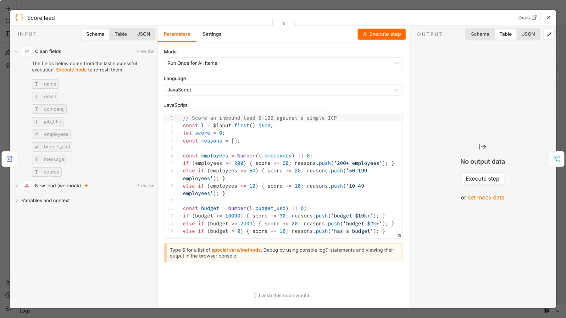 n8n Code node containing JavaScript that scores a lead from 0 to 100 using employees, budget, job title, timeline and email domain